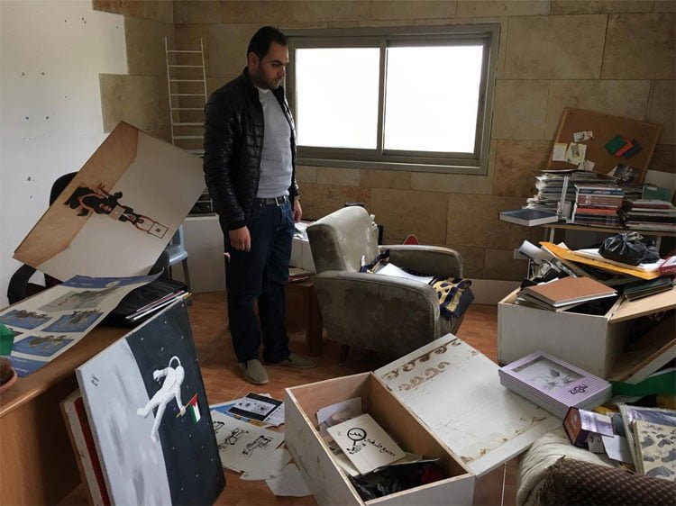 Israeli soldiers raid the studio of Palestinian cartoonist Osama Nazzal